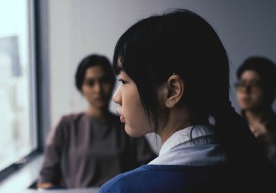 woman looking out a window