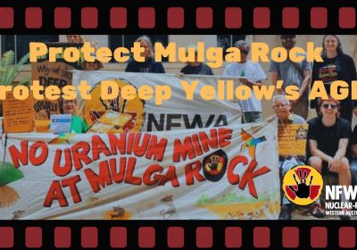 People holding a banner reading 'No uranium mine at Mulga Rock'