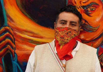 Person with scarf on face