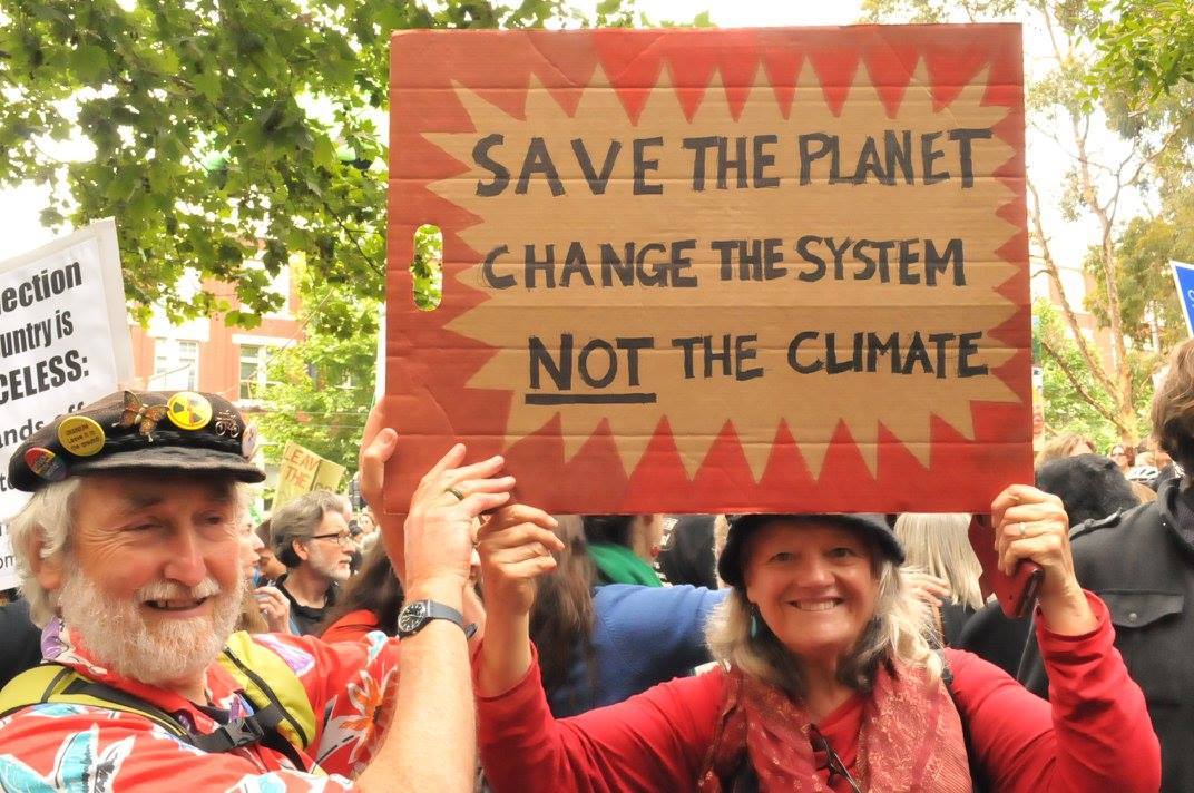 Save The Planet Change The System placard at People's Climate March, Melbourne 27 November 2015.